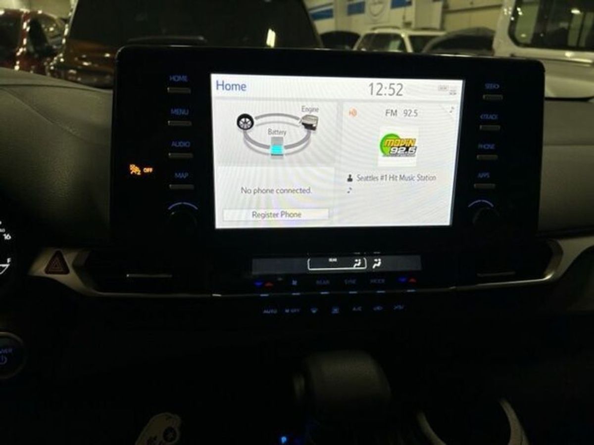 White Toyota Sienna with BraunAbility Side Entry Automatic Fold Out conversion