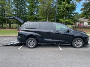 Black Toyota Sienna with Driverge Rear Entry Manual Fold Out conversion