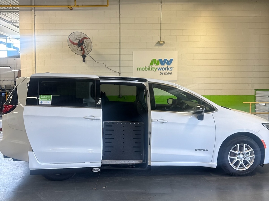 White Chrysler Pacifica with Driverge Side Entry Automatic Fold Out conversion