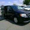 Black Dodge Grand Caravan with BraunAbility Side Entry Automatic Fold Out conversion
