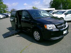 Black Dodge Grand Caravan with BraunAbility Side Entry Automatic Fold Out conversion