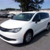 White Chrysler Voyager with Driverge Rear Entry Manual Fold Out conversion