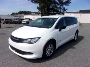 White Chrysler Voyager with Driverge Rear Entry Manual Fold Out conversion