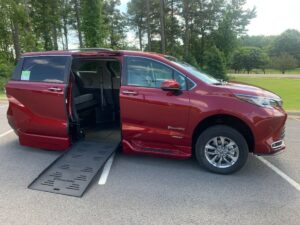 Red Toyota Sienna with BraunAbility Side Entry Automatic Fold Out conversion