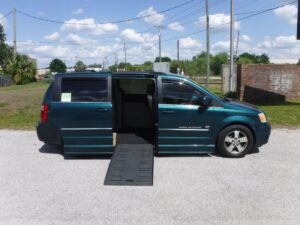 Green Dodge Grand Caravan with BraunAbility Side Entry Automatic Fold Out conversion