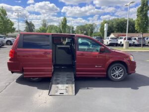 Red Dodge Grand Caravan with BraunAbility Side Entry Automatic Fold Out conversion