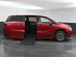 Red Honda Odyssey with BraunAbility Side Entry Automatic In Floor conversion
