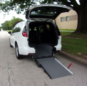 White Chrysler Pacifica with Driverge Rear Entry Manual Fold Out conversion