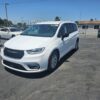 White Chrysler Pacifica with Driverge Rear Entry Manual Fold Out conversion