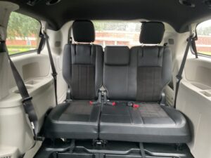 Red Dodge Grand Caravan with BraunAbility Side Entry Automatic In Floor conversion