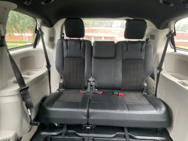 Red Dodge Grand Caravan with BraunAbility Side Entry Automatic In Floor conversion