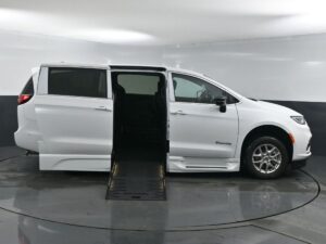 White Chrysler Pacifica with BraunAbility Side Entry Automatic Fold Out conversion