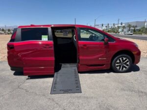 Red Honda Odyssey with BraunAbility Side Entry Automatic In Floor conversion