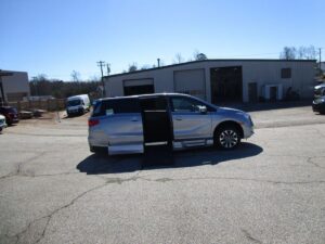 Silver Honda Odyssey with BraunAbility Side Entry Automatic In Floor conversion