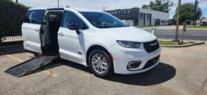 White Chrysler Pacifica with Driverge Side Entry Automatic Fold Out conversion