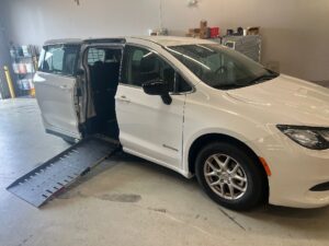 White Chrysler Voyager with Driverge Side Entry Automatic Fold Out conversion