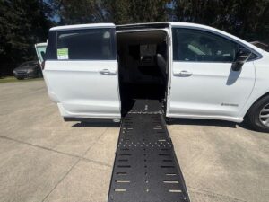 White Chrysler Pacifica with Driverge Side Entry Automatic Fold Out conversion
