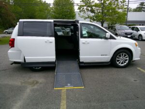 White Dodge Grand Caravan with Driverge Side Entry Automatic Fold Out conversion