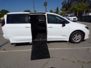White Chrysler Voyager with Driverge Side Entry Automatic Fold Out conversion
