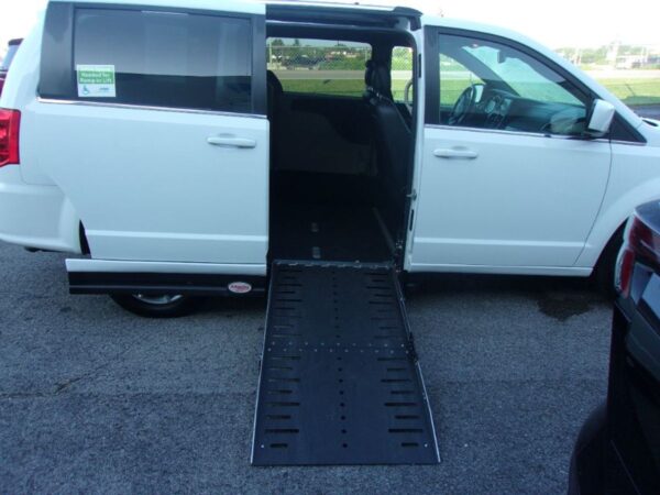 White Dodge Grand Caravan with Adaptive Vans Side Entry Automatic Fold Out conversion
