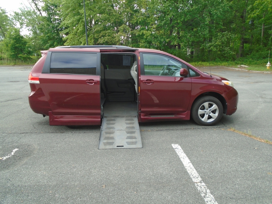 Red Toyota Sienna with BraunAbility Side Entry Automatic Fold Out conversion