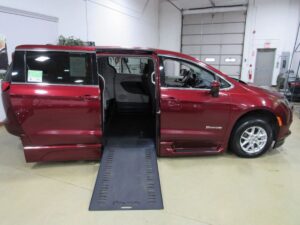 Red Chrysler Voyager with BraunAbility Side Entry Automatic In Floor conversion