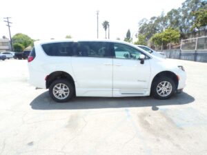 White Chrysler Voyager with BraunAbility Side Entry Automatic Fold Out conversion