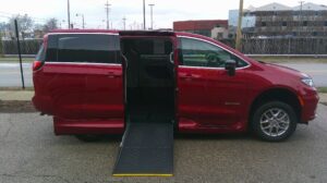 Red Chrysler Pacifica with Driverge Side Entry Automatic Fold Out conversion