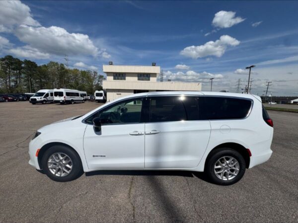 White Chrysler Voyager with Driverge Rear Entry Manual Fold Out conversion