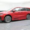 Red Honda Odyssey with BraunAbility Side Entry Automatic In Floor conversion
