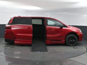 Red Honda Odyssey with BraunAbility Side Entry Automatic In Floor conversion
