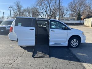 White Dodge Grand Caravan with BraunAbility Side Entry Manual Fold Out conversion