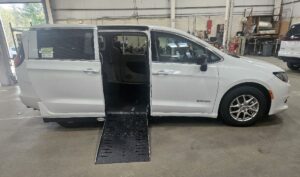 White Chrysler Voyager with Driverge Side Entry Automatic Fold Out conversion