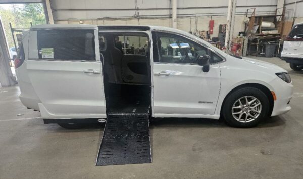 White Chrysler Voyager with Driverge Side Entry Automatic Fold Out conversion