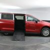Red Chrysler Voyager with BraunAbility Side Entry Manual Fold Out conversion