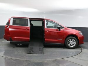 Red Chrysler Voyager with BraunAbility Side Entry Manual Fold Out conversion