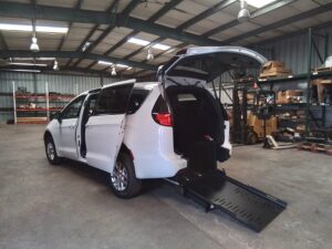 White Chrysler Pacifica with FR Conversions Rear Entry Manual Fold Out conversion