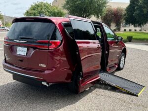 Red Chrysler Pacifica with Driverge Side Entry Automatic Fold Out conversion