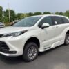 White Toyota Sienna with BraunAbility Side Entry Automatic Fold Out conversion