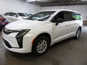 White Chrysler Pacifica with Driverge Side Entry Automatic Fold Out conversion