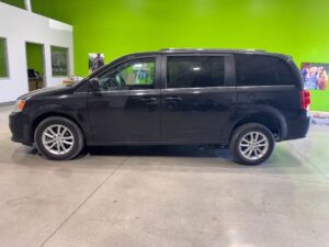 Black Dodge Grand Caravan with Driverge Side Entry Automatic Fold Out conversion