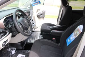 White Chrysler Voyager with BraunAbility Side Entry Automatic Fold Out conversion