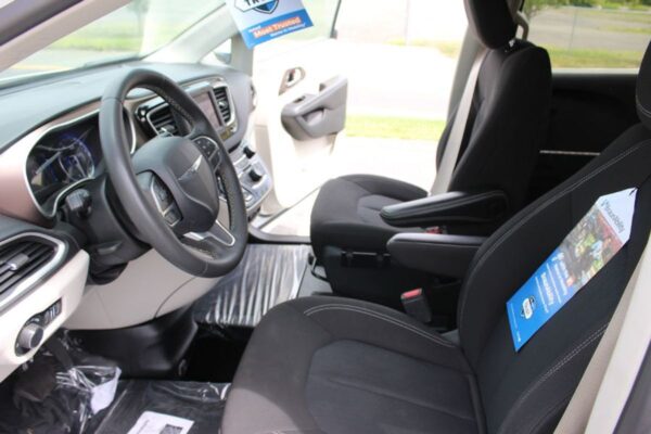 White Chrysler Voyager with BraunAbility Side Entry Automatic Fold Out conversion