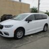 White Chrysler Pacifica with BraunAbility Side Entry Automatic Fold Out conversion