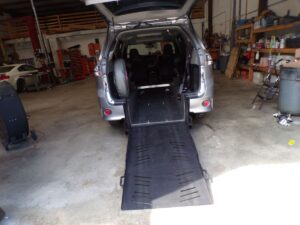 Silver Toyota Sienna with Freedom Motors Rear Entry Automatic Fold Out conversion