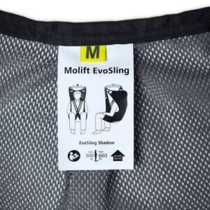 Close-up of a Molift EvoSling Shadow label on mesh fabric, featuring illustrations of proper use and specifications, including medium size and weight limits.