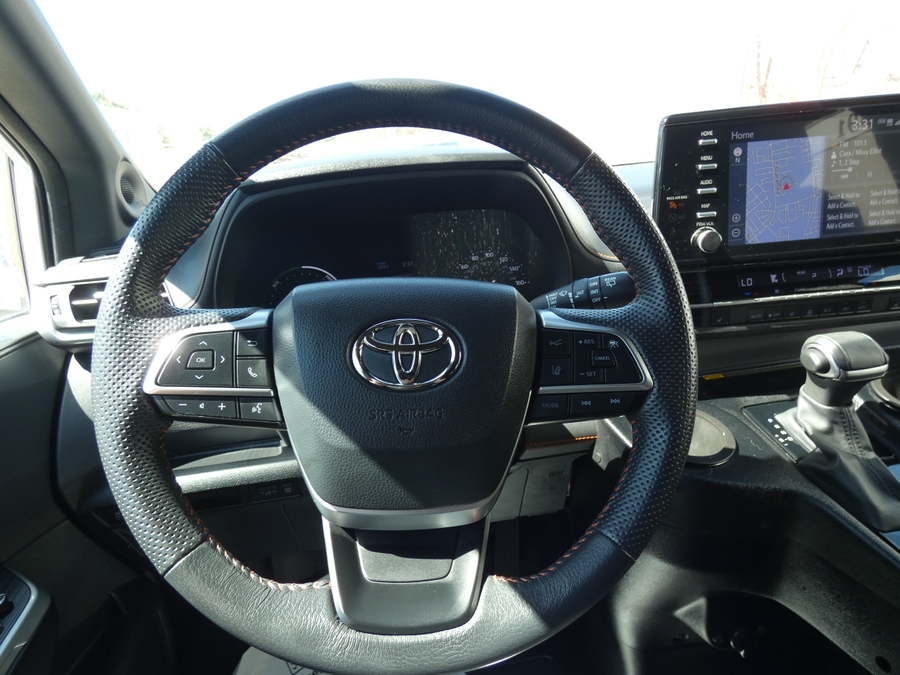 White Toyota Sienna with BraunAbility Side Entry Automatic Fold Out conversion