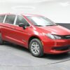 Red Chrysler Voyager with BraunAbility Rear Entry Manual Fold Out conversion