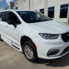 White Chrysler Pacifica with BraunAbility Side Entry Automatic Fold Out conversion