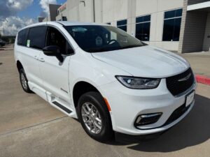 White Chrysler Pacifica with BraunAbility Side Entry Automatic Fold Out conversion